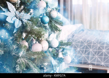 Close up of colorful ornaments on Christmas tree. Happy New Year and Christmas. Bokeh light soft effect. Stock Photo