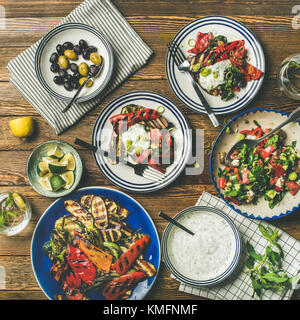 Flat-lay of healthy dinner table setting with snacks Stock Photo