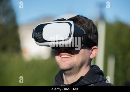 Young caucasian man using virtual box for virtual reality Stock Photo