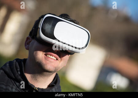 Young caucasian man using virtual box for virtual reality Stock Photo