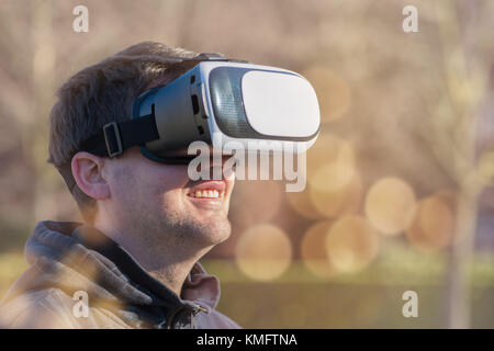 Young caucasian man using virtual box for virtual reality Stock Photo