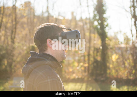 Young caucasian man using virtual box for virtual reality Stock Photo