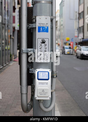 Pedestrian traffic light switch on street in Japan Stock Photo