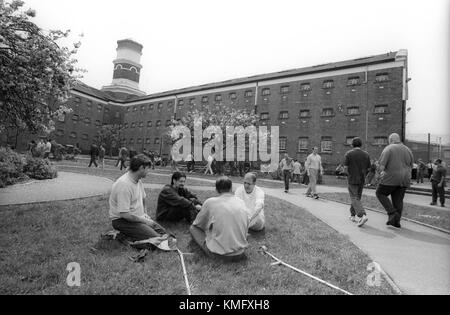 Prison inmates in exercise grounds during association, HMP Winchester, Winchester, Hampshire, United Kingdom. 10 May 2001. Stock Photo