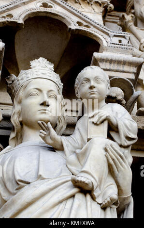 Paris, France. Notre Dame cathedral / Notre-Dame de Paris on Isle de la Cite. Gothic. Facade detail. Madonna and Child, in the Potal of the Virgin Stock Photo