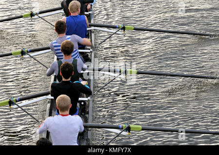 Rowing team closeup. Detail of men's eight pulling together on sweep boat. Teamwork, coordination, cooperation, dedication, discipline concept. Stock Photo