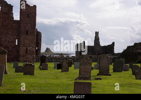 Looking to Lindisfarne castle from Lindisfarne priory, at Holy Island in Northumberland on the North East coast of England. Stock Photo