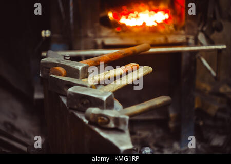 Hand anvil. hummers all blacksmith tools in forge. Stock Photo