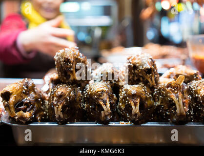 Spicy rabbit head street food in Chengdu China Stock Photo