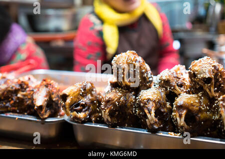 Spicy rabbit head street food in Chengdu China Stock Photo