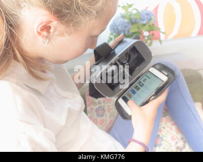Girl using virtual reality headset Stock Photo