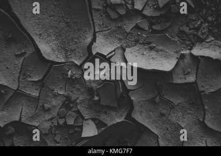 Black cracked mud. Beautiful background. Stock Photo