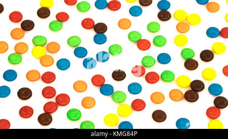 colorful button shaped chocolates candy isolated on white background Stock Photo