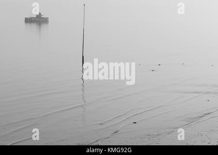 The end of the old pier, which has become detached from the rest of the pier in Herne Bay, Kent, on a foggy morning.