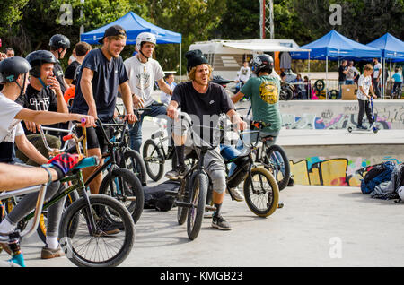 group of Bmx riders at skate park, during freestyle competition, Fuengirola, Spain. Stock Photo