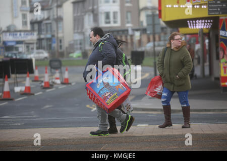 Blackpool, UK. 07th Dec, 2017. Visitors on an empty road during stormy weather in Blackpool, Lancashire,7th December, 2017 (C)Barbara Cook/Alamy Live News Credit: Barbara Cook/Alamy Live News Stock Photo