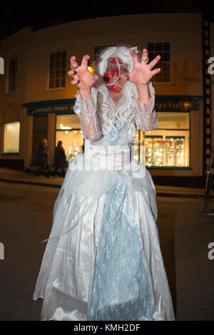 Glastonbury, UK, Saturday 9th December 2017 and as darkness settles, zombies gather for the Glastonbury Zombie Walk. Credit: Living Levels Photography/Alamy Live News Stock Photo