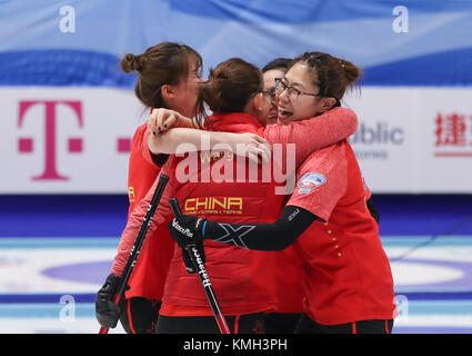 Pilsen, Czech Republic. 9th Dec, 2017. China's players celebrate victory after an Olympic Qualification match of curling for 2018 Winter Olympics in Pyeongchang between women's teams from China and Italy in Pilsen, the Czech Republic, on Dec. 9, 2017. China won 11-4 and qualified for 2018 Winter Olympics. Credit: Shan Yuqi/Xinhua/Alamy Live News Stock Photo