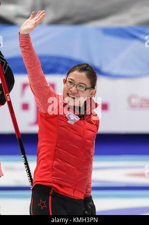 Pilsen, Czech Republic. 9th Dec, 2017. China's Wang Bingyu greets the audiences after an Olympic Qualification match of curling for 2018 Winter Olympics in Pyeongchang between women's teams from China and Italy in Pilsen, the Czech Republic, on Dec. 9, 2017. China won 11-4 and qualified for 2018 Winter Olympics. Credit: Shan Yuqi/Xinhua/Alamy Live News Stock Photo