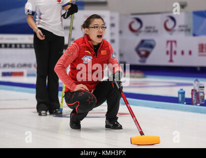 Pilsen, Czech Republic. 9th Dec, 2017. China's Wang Bingyu competes during an Olympic Qualification match of curling for 2018 Winter Olympics in Pyeongchang between women's teams from China and Italy in Pilsen, the Czech Republic, on Dec. 9, 2017. China won 11-4 and qualified for 2018 Winter Olympics. Credit: Shan Yuqi/Xinhua/Alamy Live News Stock Photo