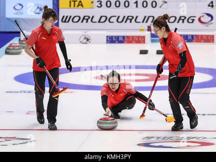 Pilsen, Czech Republic. 9th Dec, 2017. China's Zhou Yan (C) casts stone during an Olympic Qualification match of curling for 2018 Winter Olympics in Pyeongchang between women's teams from China and Italy in Pilsen, the Czech Republic, on Dec. 9, 2017. China won 11-4 and qualified for 2018 Winter Olympics. Credit: Shan Yuqi/Xinhua/Alamy Live News Stock Photo