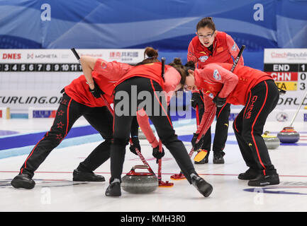 Pilsen, Czech Republic. 9th Dec, 2017. China's players compete during an Olympic Qualification match of curling for 2018 Winter Olympics in Pyeongchang between women's teams from China and Italy in Pilsen, the Czech Republic, on Dec. 9, 2017. China won 11-4 and qualified for 2018 Winter Olympics. Credit: Shan Yuqi/Xinhua/Alamy Live News Stock Photo