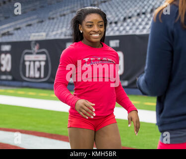 Houston, TX, USA. 10th Dec, 2017. Olympic gymnast Simone Biles walks on the field while preparing to perform as an honorary member of the Houston Texans Cheerleaders at an NFL football game between the Houston Texans and the San Francisco 49ers at NRG Stadium in Houston, TX. Trask Smith/CSM/Alamy Live News Stock Photo