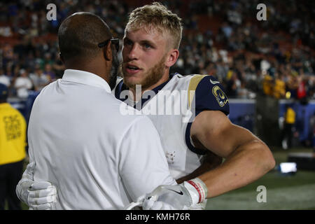 Los Angeles, CA, USA. 10th Dec, 2017. Los Angeles Rams wide receiver Cooper Kupp (18) and Torry Holt embrace after the NFL Philadelphia Eagles vs Los Angeles Rams at the Los Angeles Memorial Coliseum in Los Angeles, Ca on December 10, 2017. (Absolute Complete Photographer & Company Credit: Jevone Moore/Cal Sport Media (Network Television please contact your Sales Representative for Television usage. Credit: csm/Alamy Live News Stock Photo