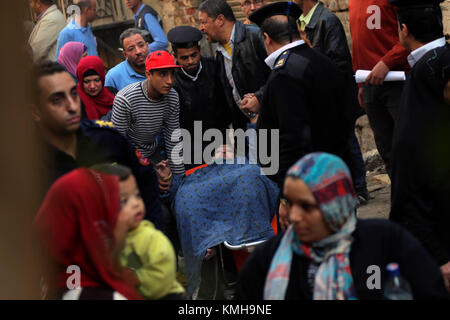 Cairo, Egypt. 12th Dec, 2017. Rescuers work at the site of a building collapse in the Shobra borough in Cairo, Egypt, on Dec. 12, 2017. At least two people were killed and six were injured in the accident, according to local media. Credit: Ahmed Gomaa/Xinhua/Alamy Live News Stock Photo