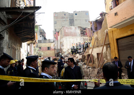 Cairo, Egypt. 12th Dec, 2017. Rescuers work at the site of a building collapse in the Shobra borough in Cairo, Egypt, on Dec. 12, 2017. At least two people were killed and six were injured in the accident, according to local media. Credit: Ahmed Gomaa/Xinhua/Alamy Live News Stock Photo