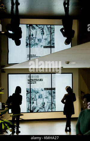 (171212) -- THE HAGUE, Dec. 12, 2017 (Xinhua) -- People view an exhibition of documents on Nanjing Massacre during a memorial in The Hague, the Netherlands, on Dec. 12, 2017. Some 200 Chinese people and students living in the Netherlands attended a memorial of Nanjing Massacre, held one day ahead of China's 'National Memorial Day for Nanjing Massacre Victims.' (Xinhua/Rick Nederstigt) Stock Photo