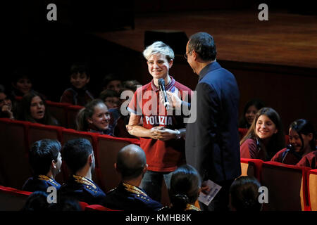 Rome, Italy - 11 December 2017: Carlo Conti interviews the paralympic athlete of the Fiamme Oro Beatrice Vio, in the audience of the Parco della Music Stock Photo