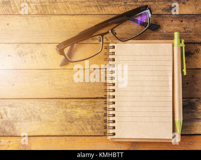 Blank notebooks and glasses on wooden boards Stock Photo