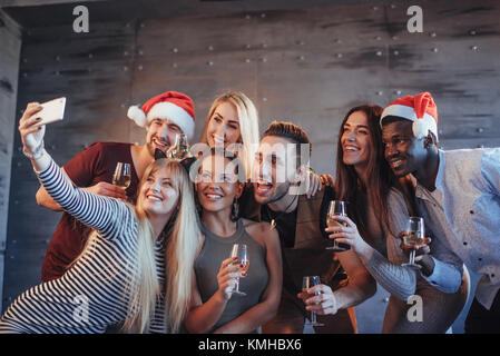 Group beautiful young people doing selfie in the new year party, best friends girls and boys together having fun, posing emotional lifestyle people. H Stock Photo