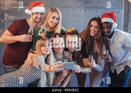 Group beautiful young people doing selfie in the new year party, best friends girls and boys together having fun, posing emotional lifestyle people. H Stock Photo