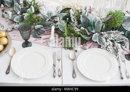 Table served for Christmas dinner in living room, top view. Stock Photo