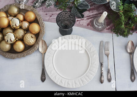 Table served for Christmas dinner in living room, top view. Stock Photo