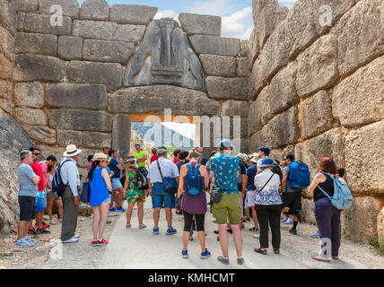 Group of tourists at the Lion Gate in Mycenae, Mikines, Peloponnese, Greece Stock Photo