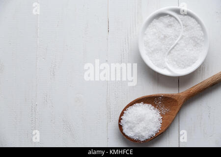 Different types of salt. Top view on black in wood spoons. Copy space Stock Photo