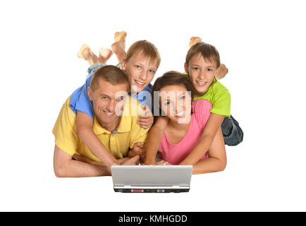 Parents with sons using laptop Stock Photo
