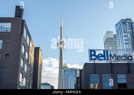 TORONTO, CANADA - DECEMBER 20, 2016: Bell Media main office for Toronto and its logo with the Canadian National Tower (CN Tower) in the background. Be Stock Photo