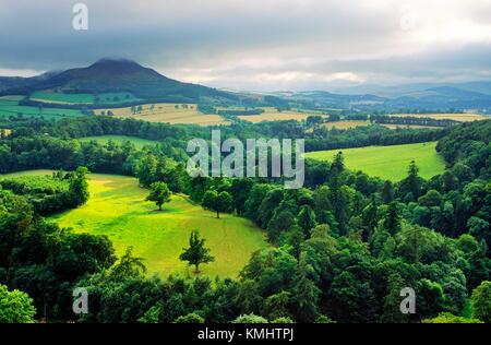 View over the River Tweed toward the three peaks of the Eildon Hills in ...