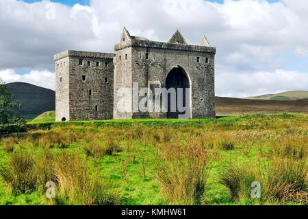 Hermitage Castle in Liddesdale in the Borders Region. For centuries part of the debateable lands between England and Scotland Stock Photo