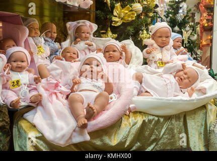 Realistic baby dolls for kids, displayed in shop window, Spain Stock Photo