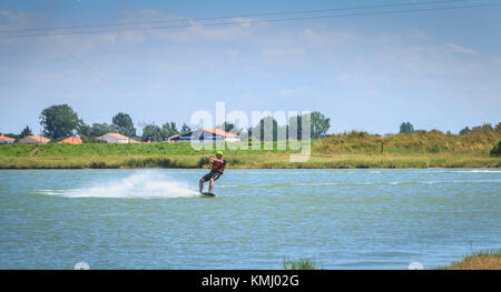 Aiguillon-sur-Mer, France, France - July 06, 2016 : installing a wake park during the 2016 season on the Lake of Aiguillon sur Mer, France - wakeboard Stock Photo