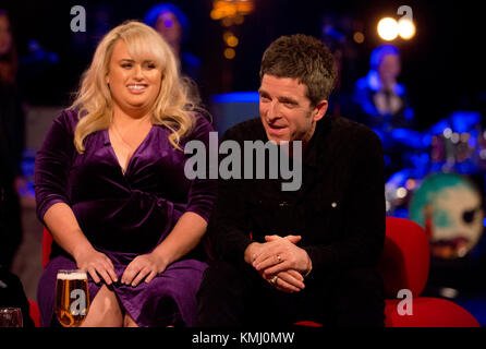 (left to right) Rebel Wilson and Noel Gallagher during filming of the Graham Norton Show at The London Studios, to be aired on BBC One on Friday. Stock Photo