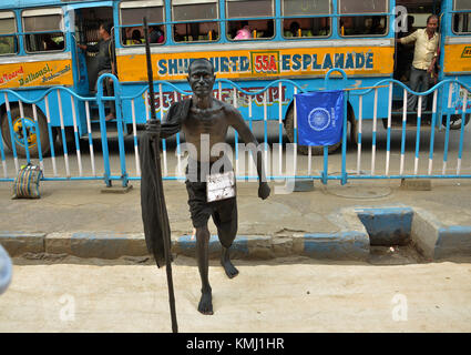 Kolkata, India. 06th Dec, 2017. A man dressed as the leader of the Indian independence movement Mahatma Mohandas Karamchand Gandhi in dhoti and stick at the street. Credit: Sanjay Purkait/Pacific Press/Alamy Live News Stock Photo