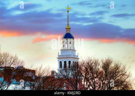 Lowell House, Harvard University. White bell tower, iconic blue dome, sunset sky, winter scene. Stock Photo