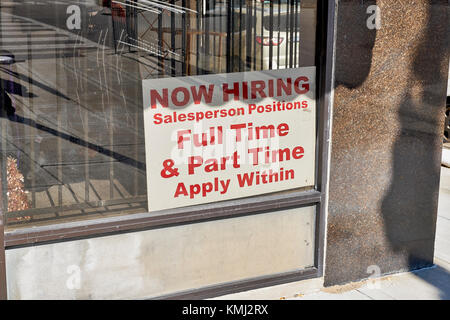 Help wanted sign in a small business window in downtown Montgomery Alabama, USA. Stock Photo