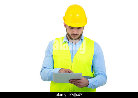 Handsome engineer working with a tablet pc, isolated on white Stock Photo